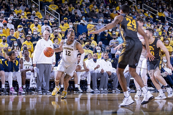 DeVante' Jones (12), Hunter Dickinson (1), and Phil Martelli