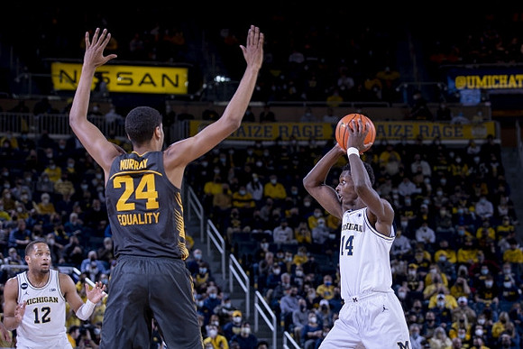 DeVante' Jones (12) and Moussa Diabate (14)