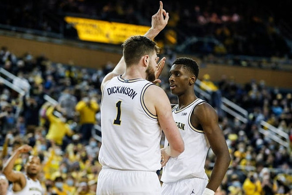 Hunter Dickinson (1) and Moussa Diabate (14)