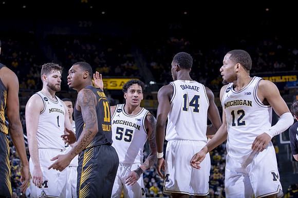 Hunter Dickinson (1), Eli Brooks (55), Moussa Diabate (14), and DeVante' Jones (12)
