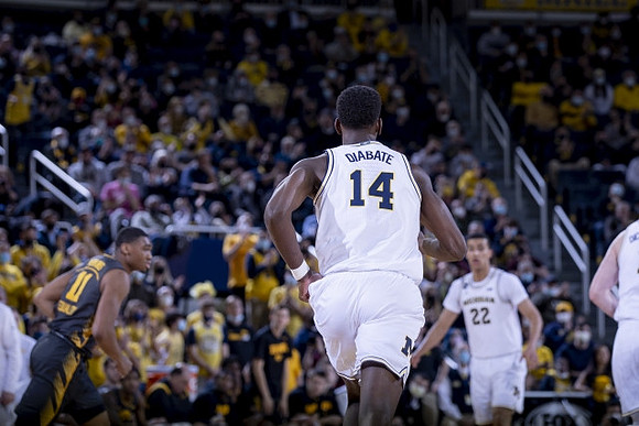 Moussa Diabate (14) and Caleb Houstan (22)