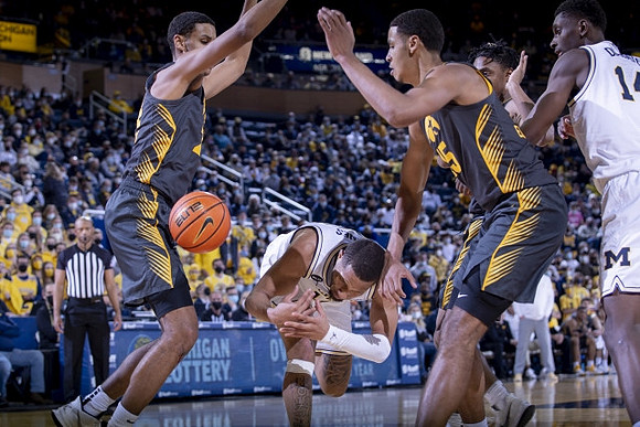 DeVante' Jones (12) and Moussa Diabate (14)