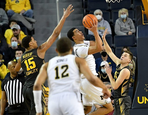 DeVante' Jones (12) and Caleb Houstan (22)