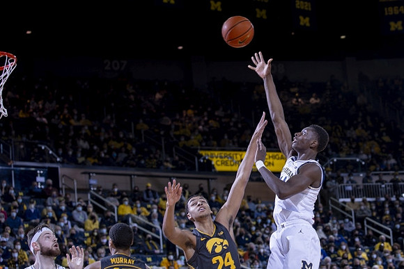 Hunter Dickinson (1) and Moussa Diabate (14)