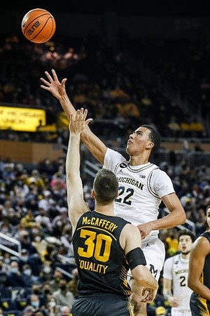 Caleb Houstan (22) and Brandon Johns Jr. (23)