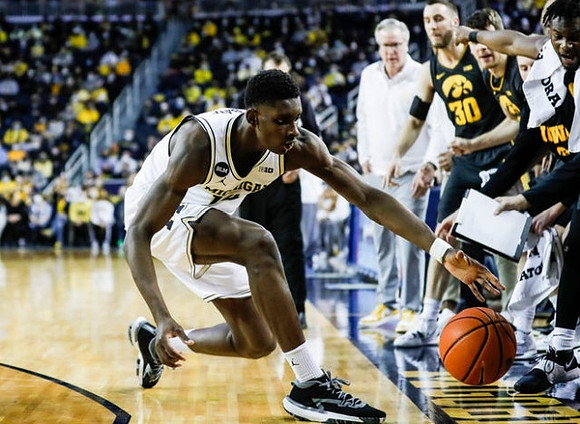 Moussa Diabate (14) and Iowa Head Coach Fran McCaffery
