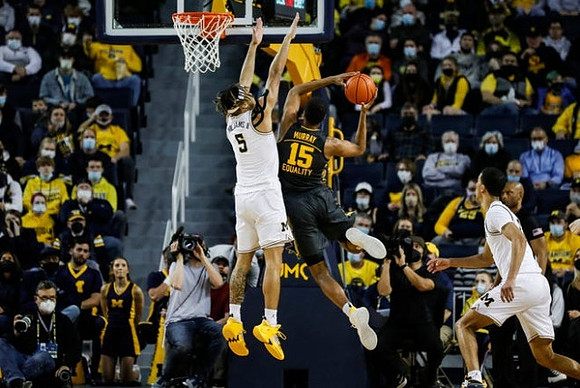 Terrance Williams II (5) and Caleb Houstan (22)