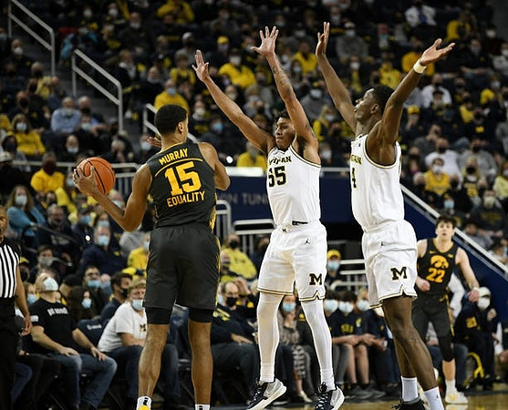 Eli Brooks (55) and Moussa Diabate (14)