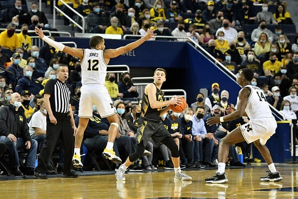 DeVante' Jones (12) and Moussa Diabate (14)