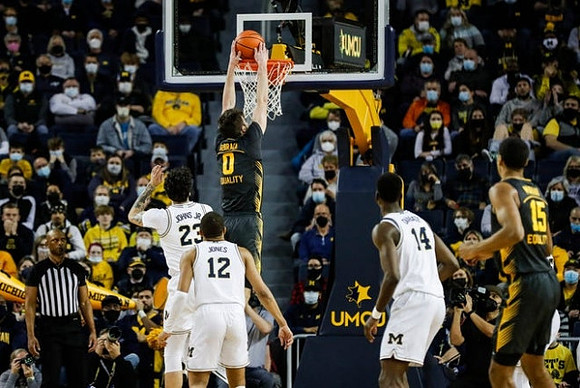 Brandon Johns Jr. (23), DeVante' Jones (12), and Moussa Diabate (14)