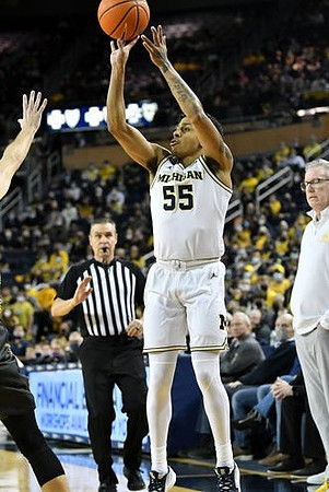Eli Brooks (55) and Iowa Head Coach Fran McCaffery
