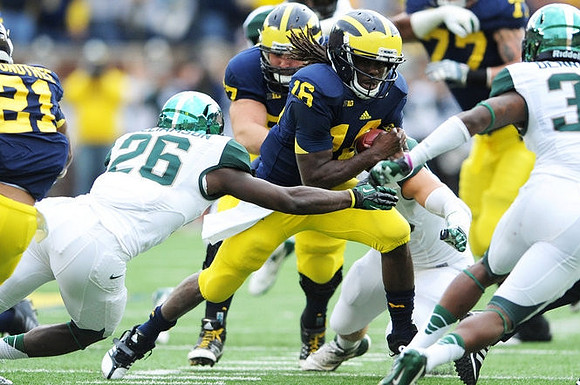 Mike Kwiatkowski (81), Denard Robinson (16),  Michael Schofield (75), and Taylor Lewan (77)