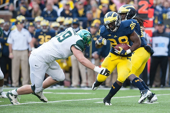Denard Robinson (16) and Fitzgerald Toussaint (28)