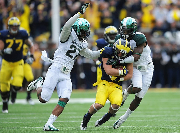 Drew Dileo (9), Denard Robinson (16), and Taylor Lewan (77)