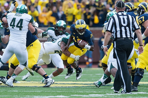 Denard Robinson (16), Michael Schofield (75), Elliott Mealer (57), and Patrick Omameh (65)