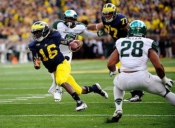 Denard Robinson (16) and Taylor Lewan (77)
