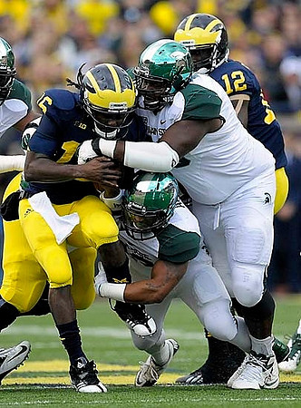 Denard Robinson (16) and Devin Gardner (12)