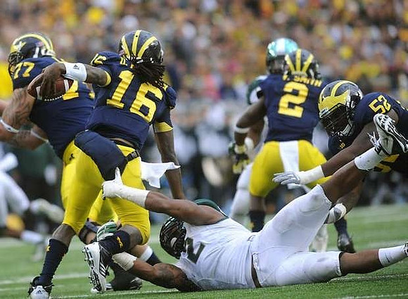 Taylor Lewan (77), Denard Robinson (16), Vincent Smith (2), and Ricky Barnum (52)