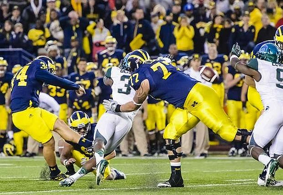 Brendan Gibbons (34), Drew Dileo (9), and Taylor Lewan (77)