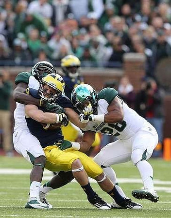 Drew Dileo (9) and Denard Robinson (16)