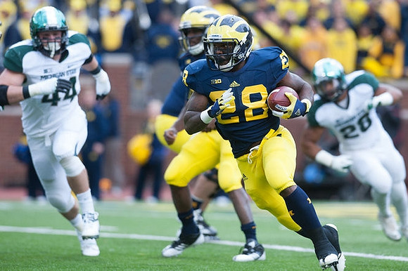 Denard Robinson (16) and Fitzgerald Toussaint (28)