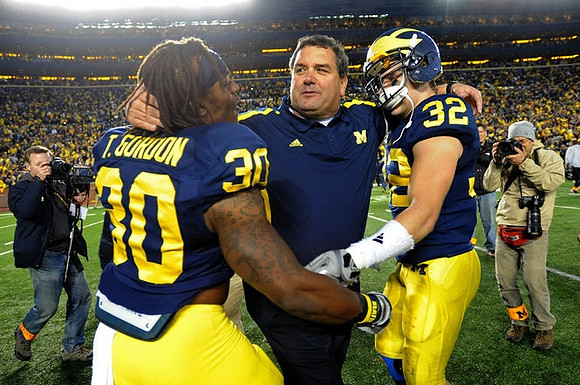 Thomas Gordon (30), Brady Hoke, and Jordan Kovacs (32)