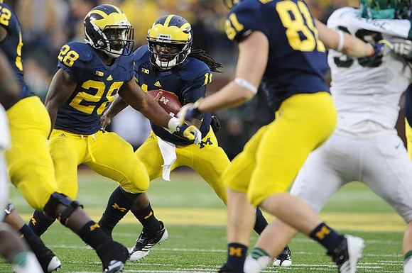 Ricky Barnum (52), Fitzgerald Toussaint (28), Denard Robinson (16), and Mike Kwiatkowski (81)