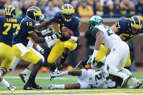 Taylor Lewan (77), Devin Gardner (12), Denard Robinson (16), and Elliott Mealer (57)