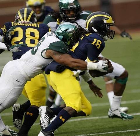 Fitzgerald Toussaint (28) and Denard Robinson (16)