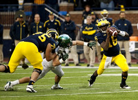 Michael Schofield (75) and Denard Robinson (16)