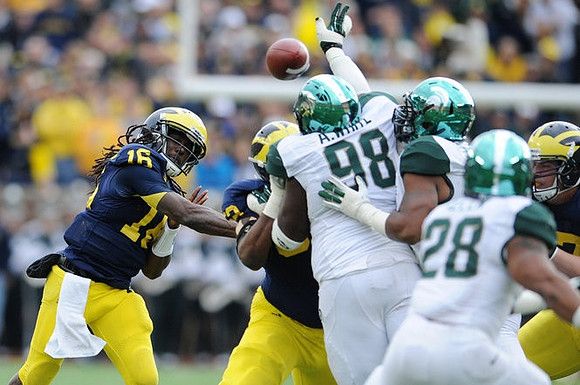 Denard Robinson (16), Ricky Barnum (52), and Michael Schofield (75)