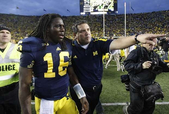 Denard Robinson (16) and Brady Hoke