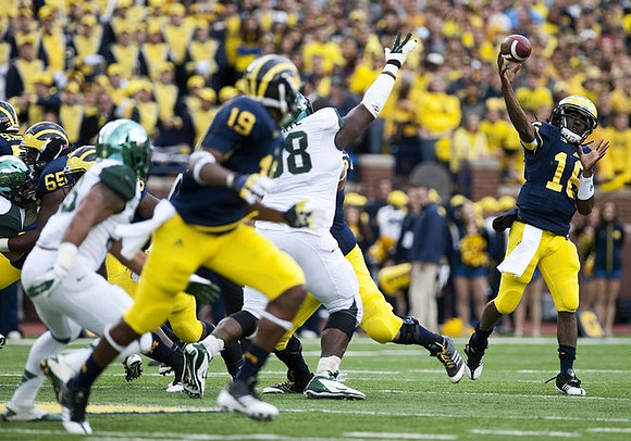 Patrick Omameh (65), Devin Funchess (19), and Denard Robinson (16)