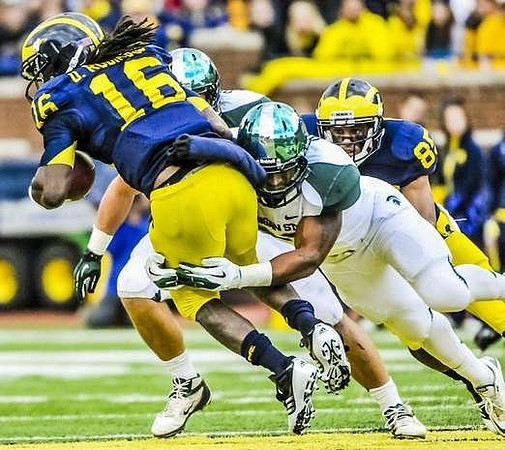 Denard Robinson (16) and Mike Kwiatkowski (81)