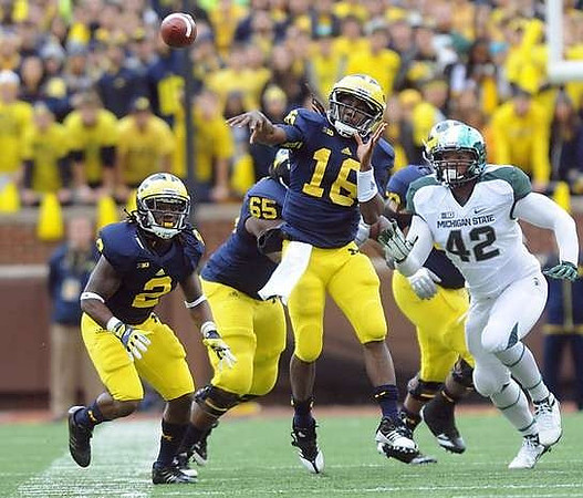 Vincent Smith (2), Patrick Omameh (65), Denard Robinson (16), and Ricky Barnum (52)