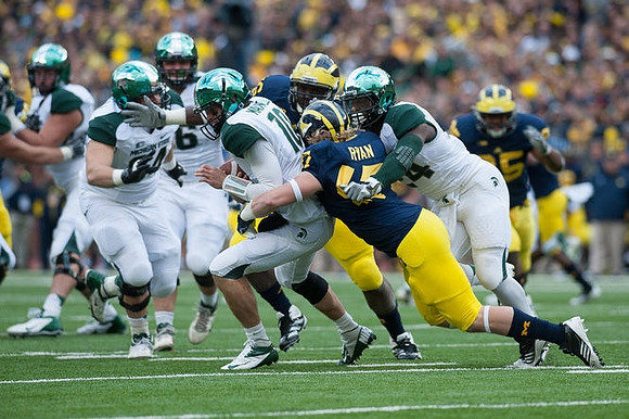 Jake Ryan (47), Quinton Washington (76), and Kenny Demens (25)