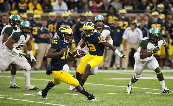 Denard Robinson (16) and Devin Gardner (12)