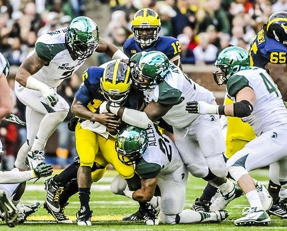 Denard Robinson (16), Devin Gardner (12), and Patrick Omameh (65)