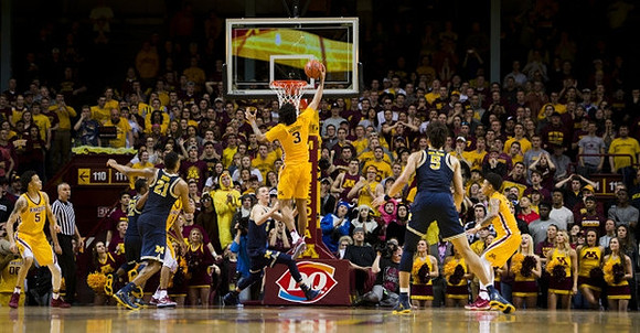 Zak Irvin (21), Duncan Robinson (22), and D.J. Wilson (5)