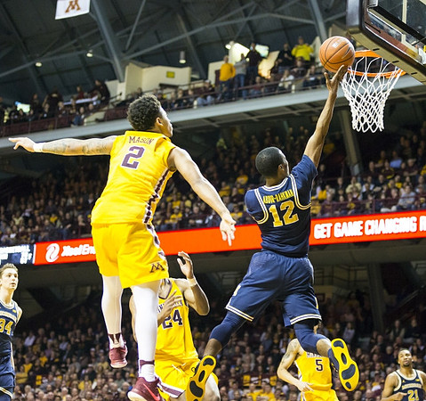 Mark Donnal (34), Muhammad-Ali Abdur-Rahkman (12), and Zak Irvin (21)