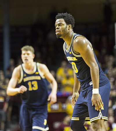 Moritz Wagner (13) and Derrick Walton Jr. (10)