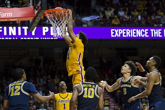 Muhammad-Ali Abdur-Rahkman (12), Derrick Walton Jr. (10), D.J. Wilson (5), and Zak Irvin (21)