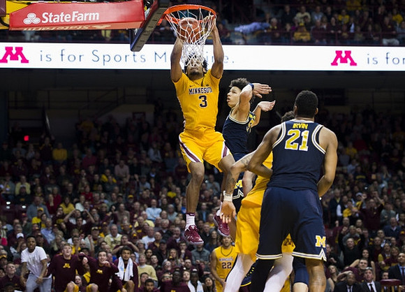 D.J. Wilson (5) and Zak Irvin (21)