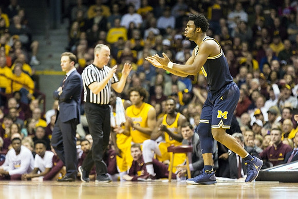 Minnesota Head Coach Richard Pitino and Derrick Walton Jr. (10)