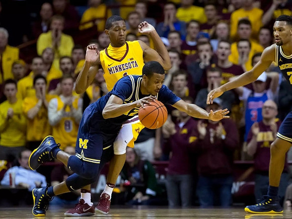 Muhammad-Ali Abdur-Rahkman (12) and Zak Irvin (21)