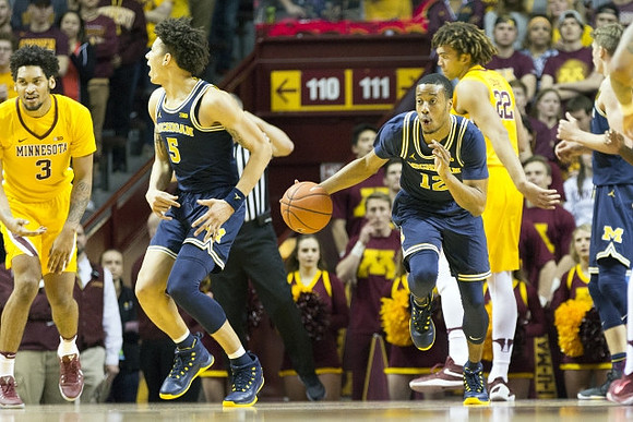 D.J. Wilson (5), Muhammad-Ali Abdur-Rahkman (12), and Moritz Wagner (13)