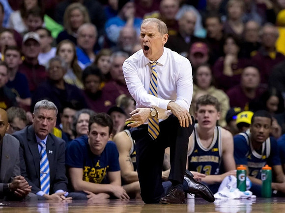 Jeff Meyer, Andrew Dakich (11) , John Beilein, Moritz Wagner (13), and Muhammad-Ali Abdur-Rahkman (12)