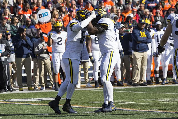 Josh Uche (6) and Michael Danna (4)
