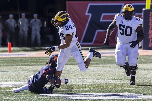 Zach Charbonnet (24) and Michael Onwenu (50)