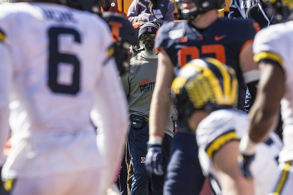 Josh Uche (6) and Illinois Head Coach Lovie Smith